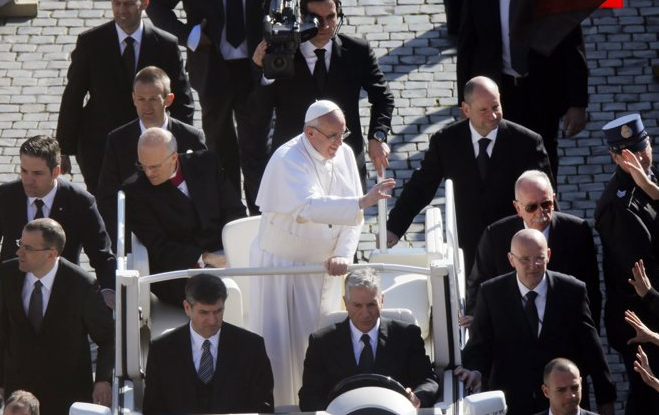 The pope with his armed guards. 